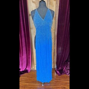 Lovely blue backless evening gown with beads and strap neck